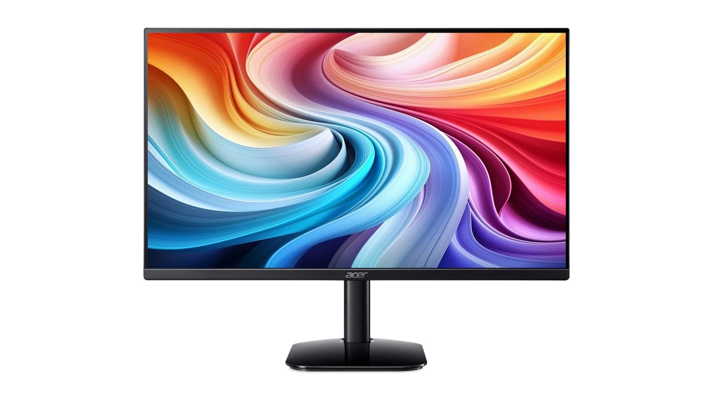 A black Acer monitor with a colorful abstract wallpaper displayed on the screen.
