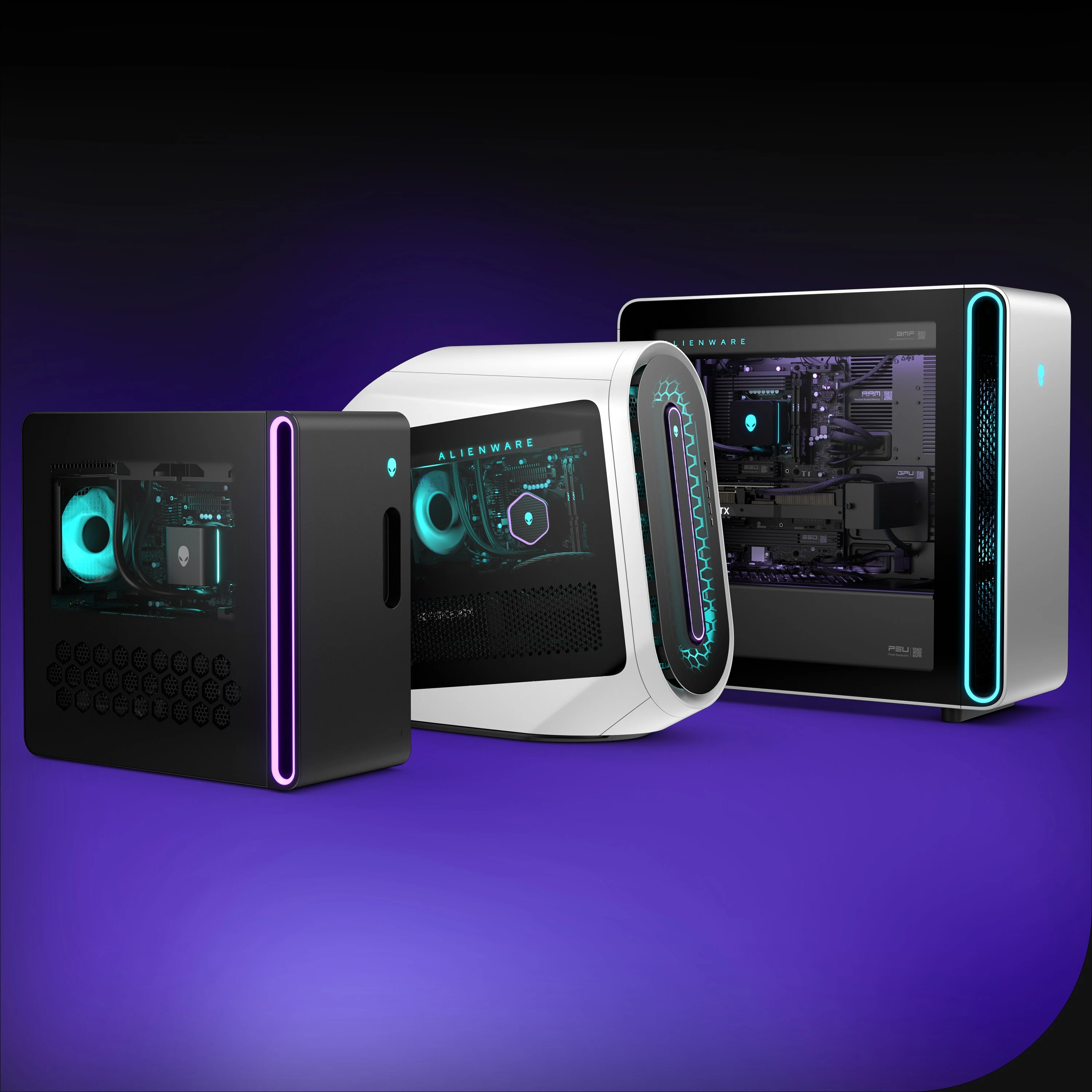 The image shows three Alienware Aurora Gaming Desktops with different color finishes: black, white, and silver. The camera angle is a side profile view.