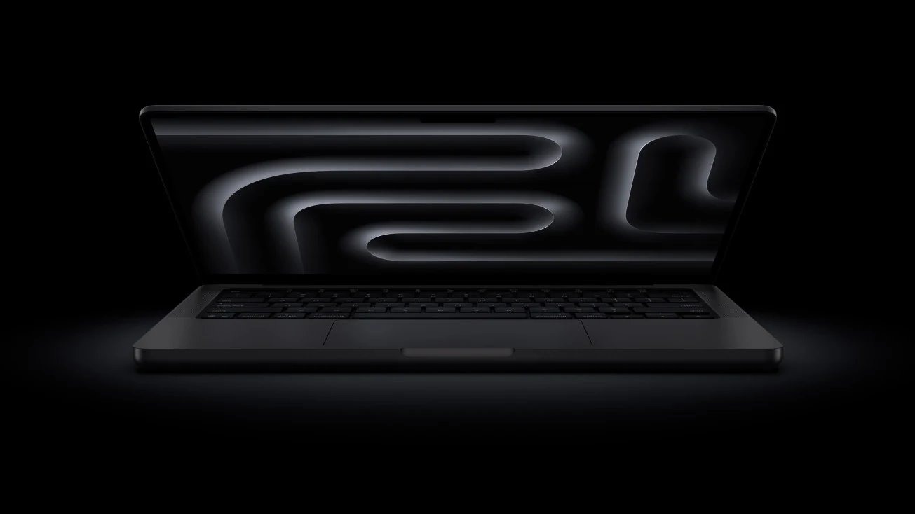 A black MacBook Pro with a sleek design, viewed from the front.