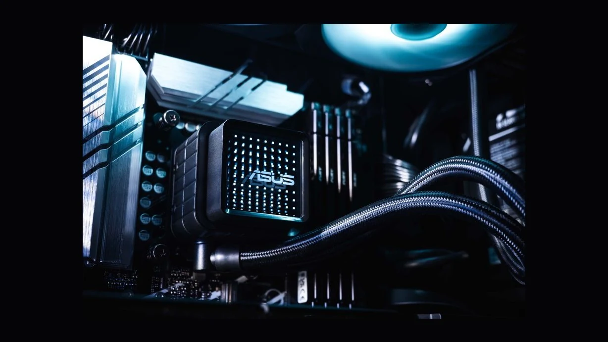 A close-up of an ASUS cooling product with a black finish and blue LED lighting, integrated into a computer setup.