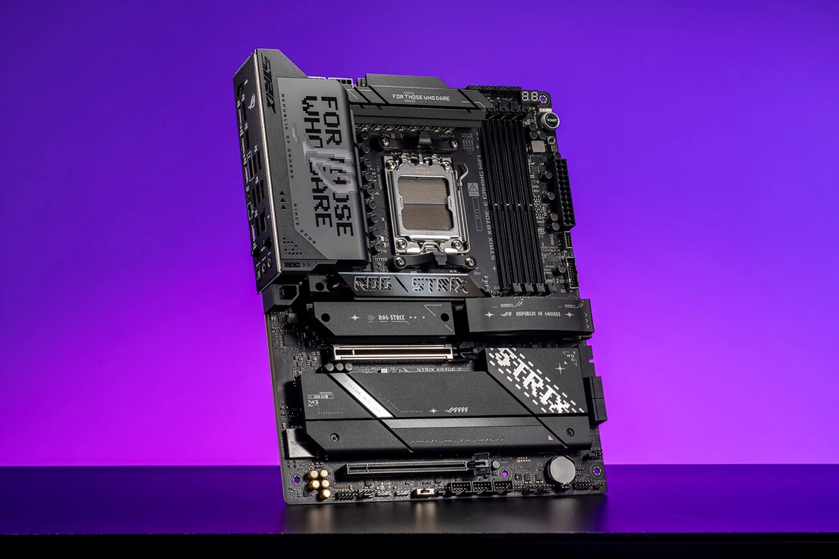 A black motherboard with a purple background, viewed from the front.