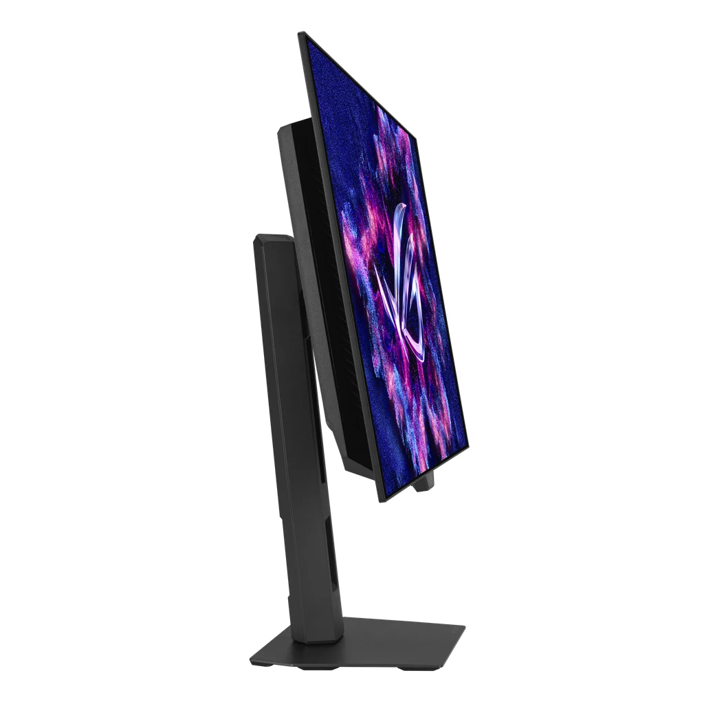 The ASUS ROG XG27AQDMGR monitor is shown in a side profile, with its back panel visible and the screen displaying a colorful abstract pattern.