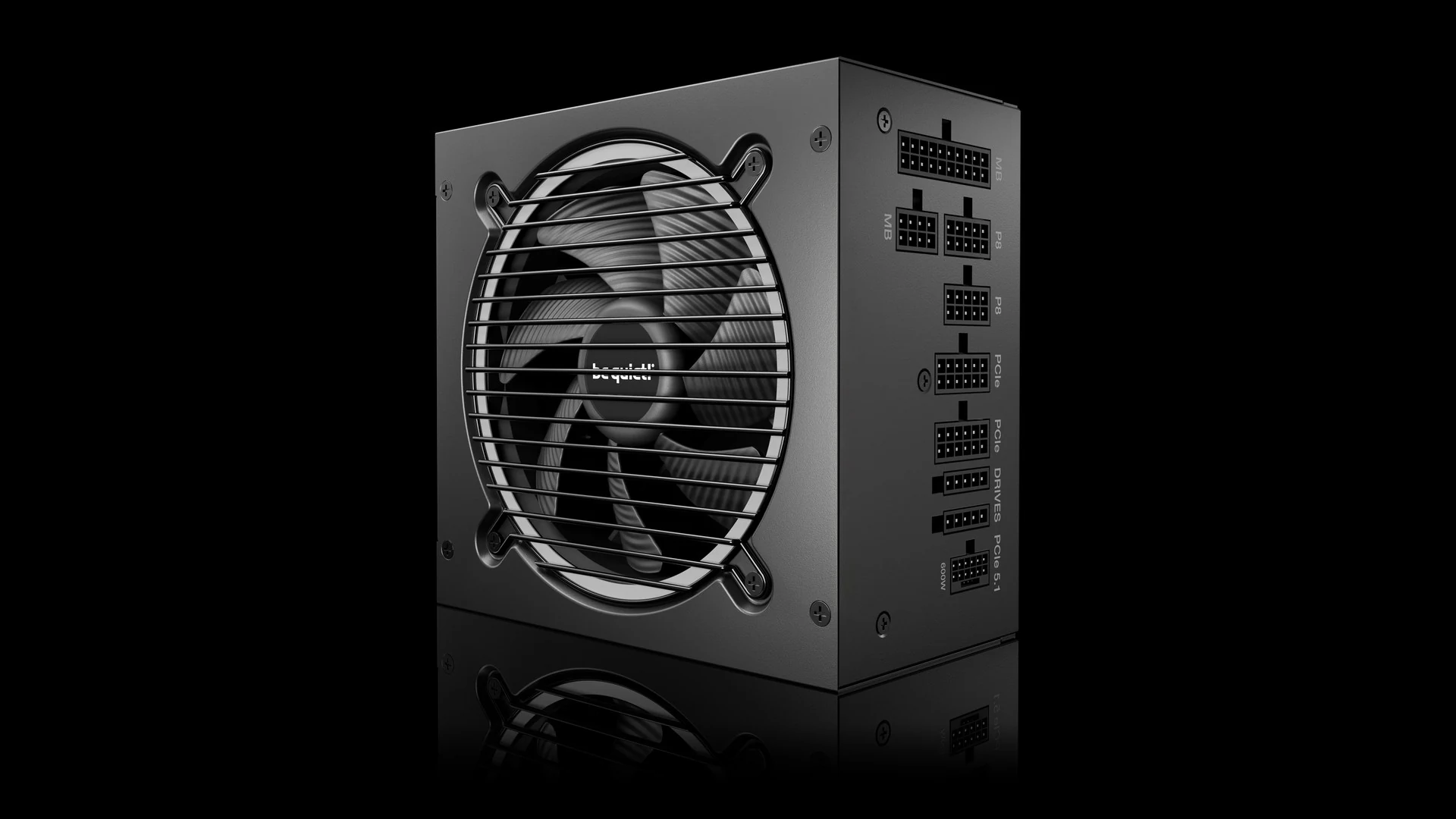 A black power supply unit with a fan and various connection ports visible, photographed from the front.