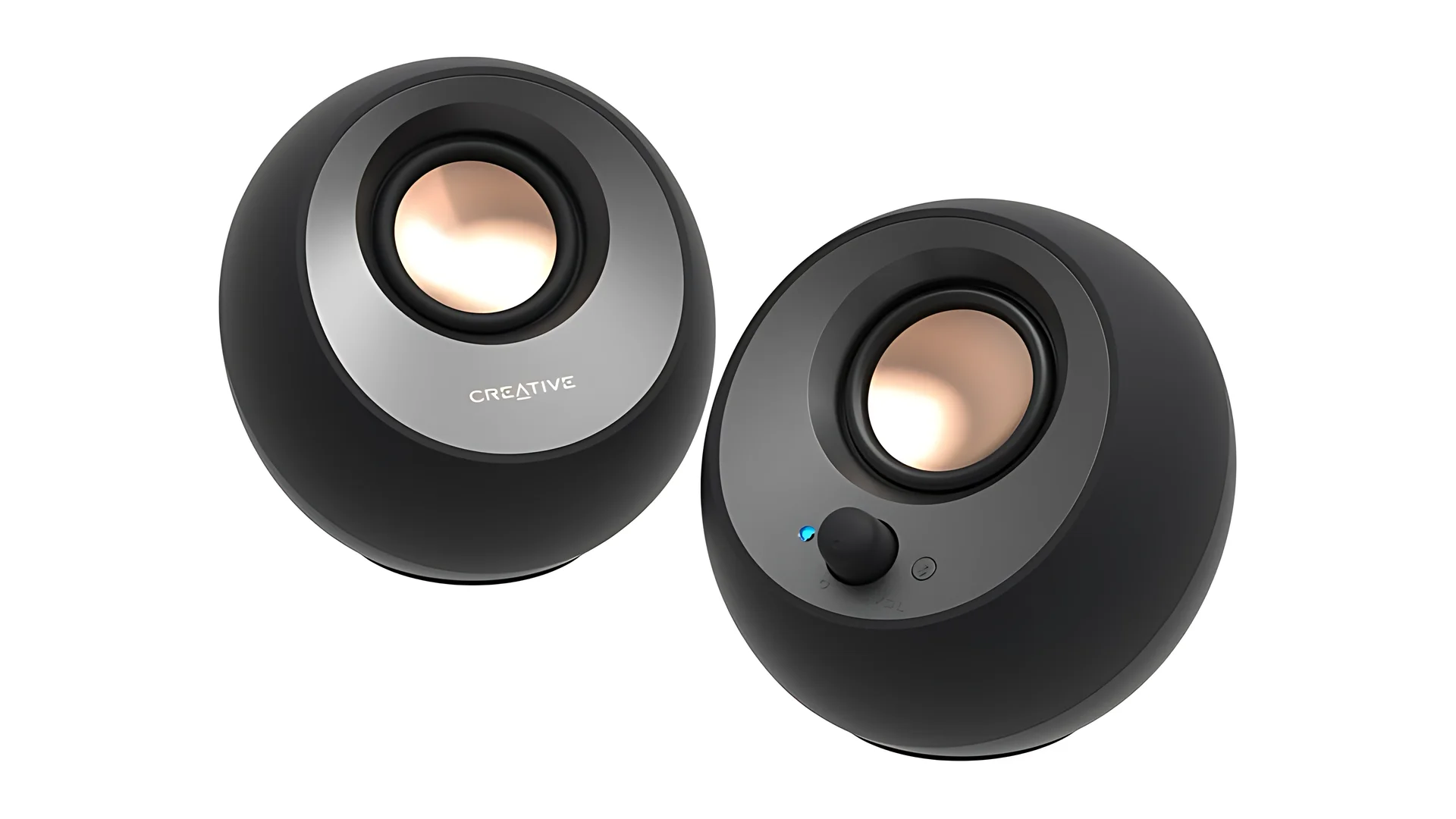 Two black Creative Pebble V3 speakers with a metallic finish and a control knob on the side.