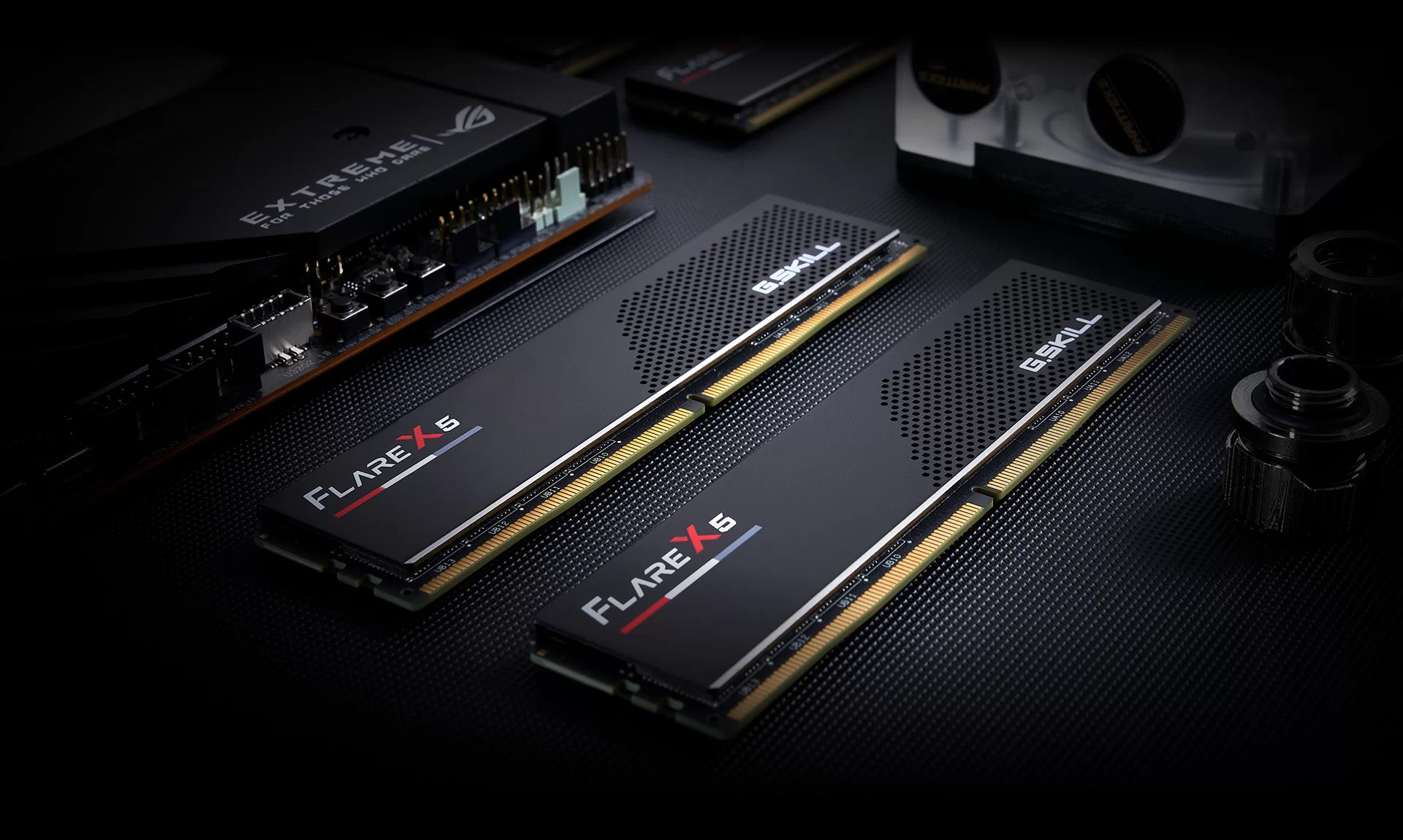 The image shows two G.SKILL Flare X5 Series DDR5 memory modules with a black and red color scheme, placed on a dark textured surface.