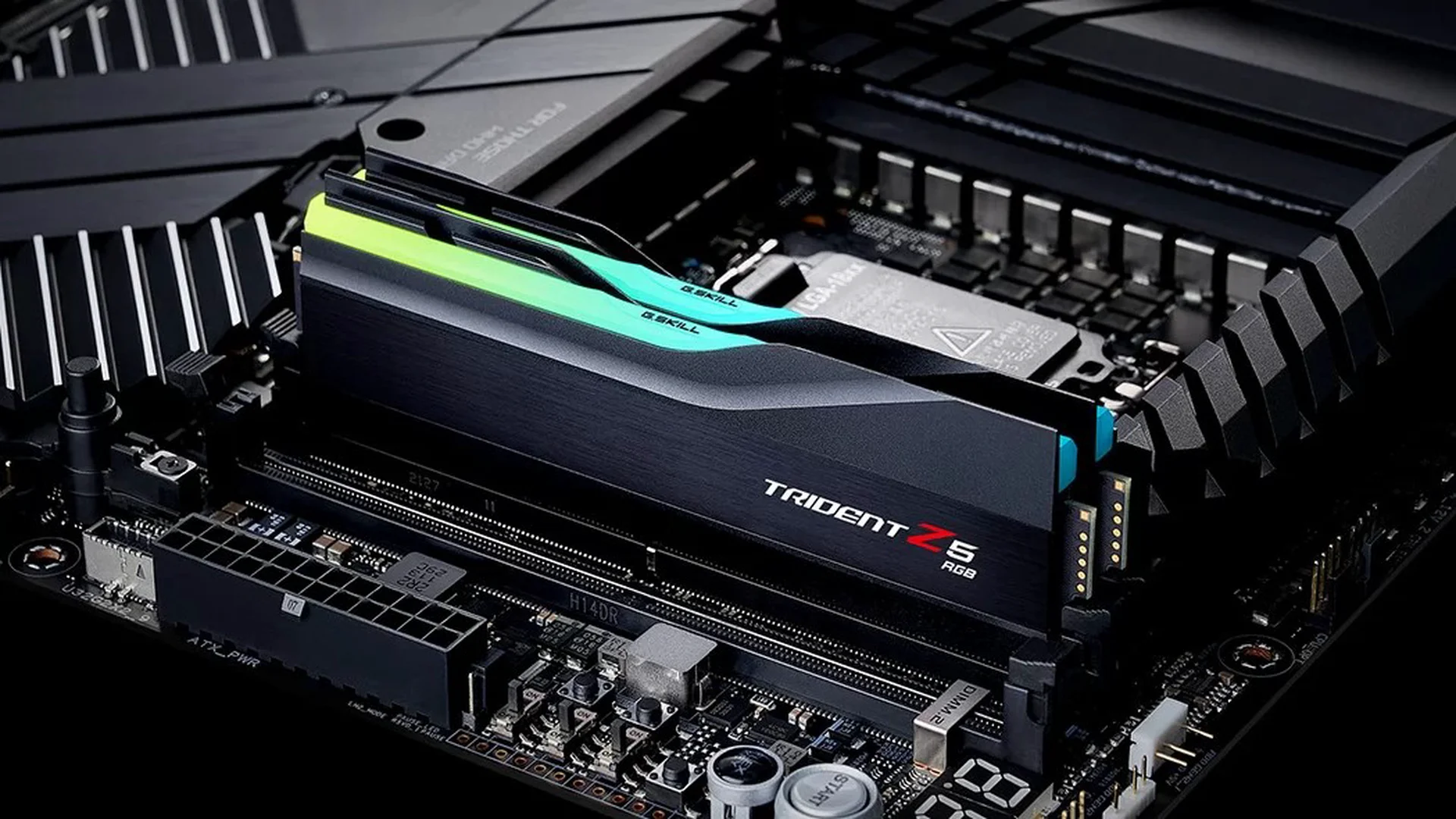 A close-up of a G.SKILL Trident Z5 RGB Series DDR5 memory module installed on a motherboard.