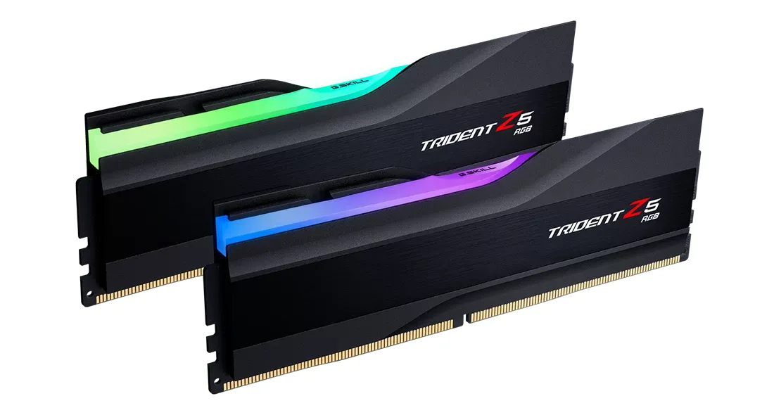 The image shows a close-up of two G.SKILL Trident Z5 RGB Series DDR5 memory modules with vibrant RGB lighting.