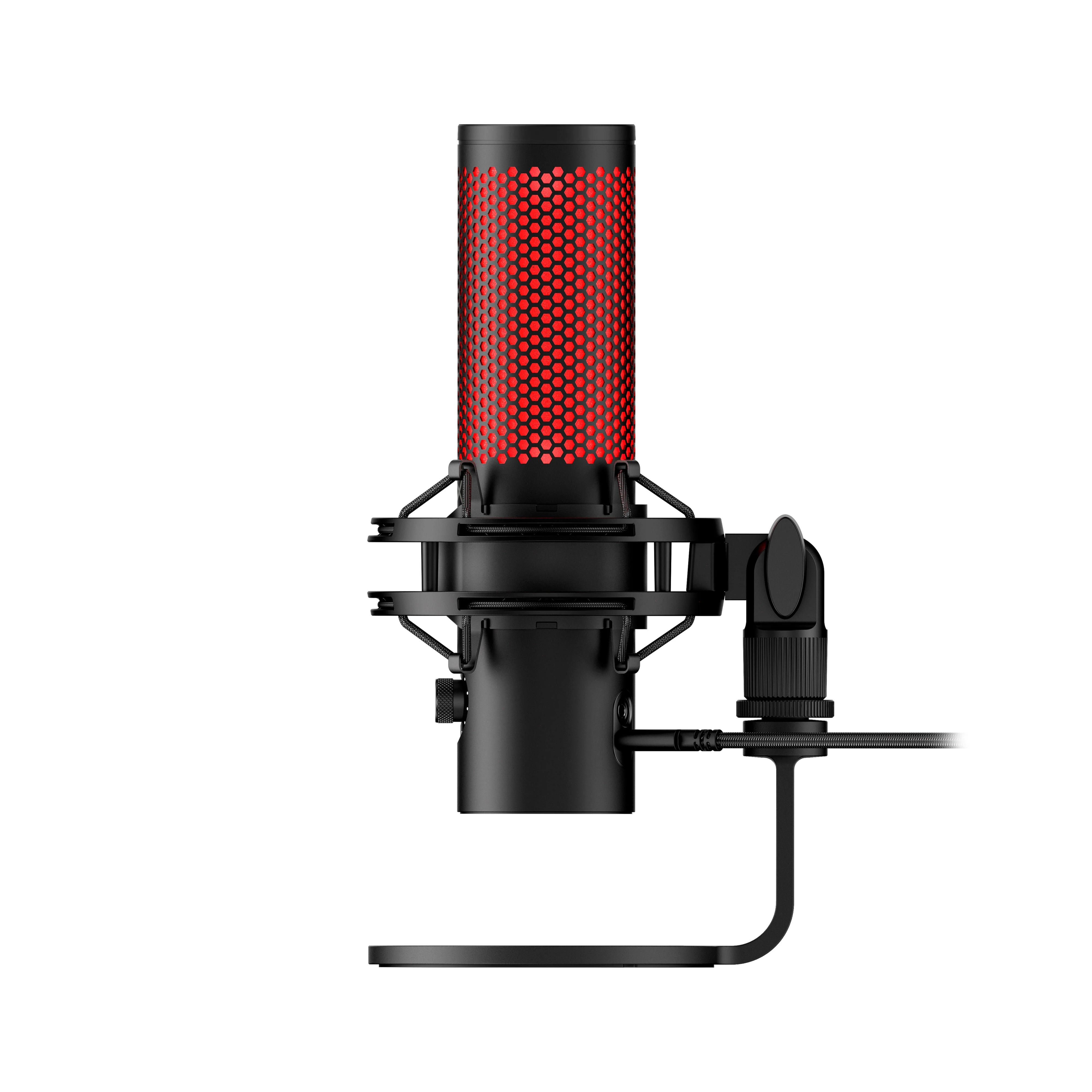 The image shows a black microphone with red hexagonal mesh on the top, mounted on a stand.