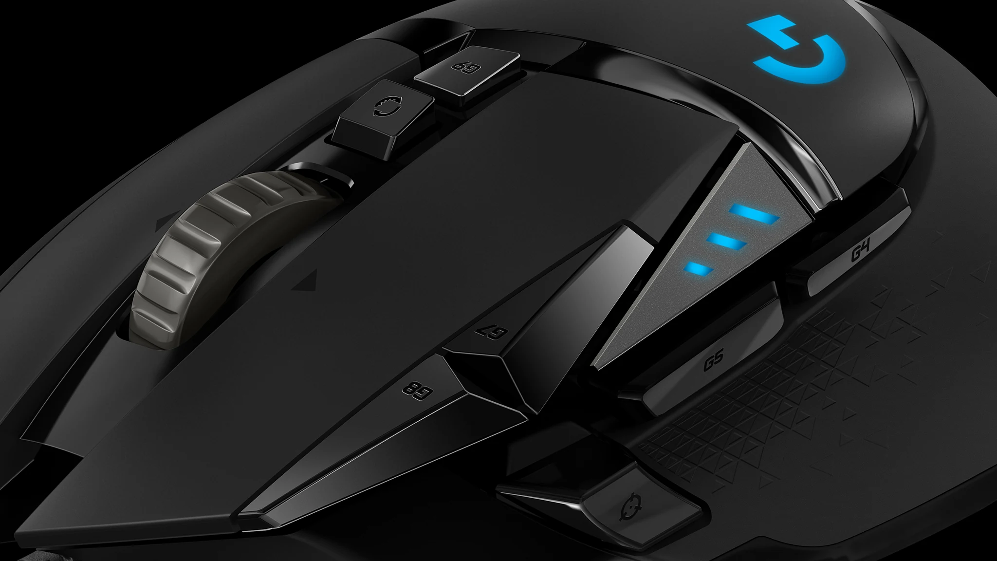 A close-up of a black gaming mouse with textured surfaces and illuminated blue lights.