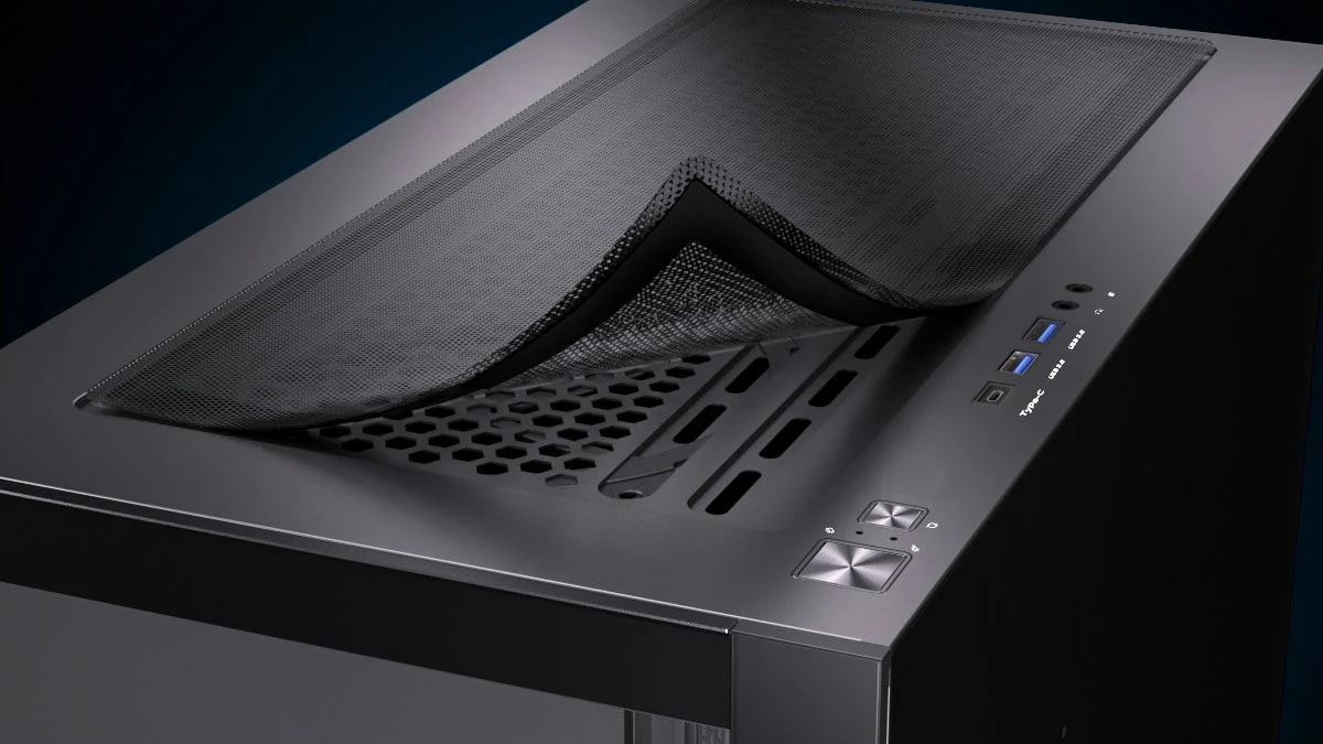 A black computer case with a textured front panel and visible ports on the side.