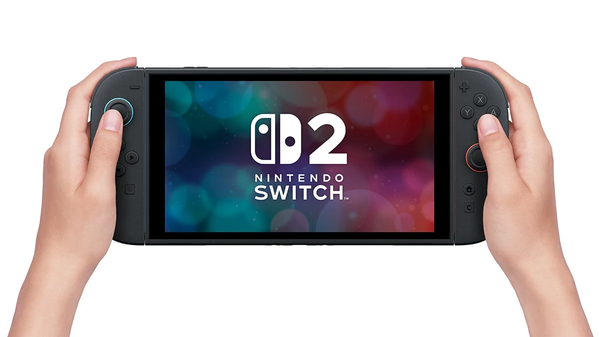 Hands holding the Nintendo Switch 2 in handheld mode with the screen lit