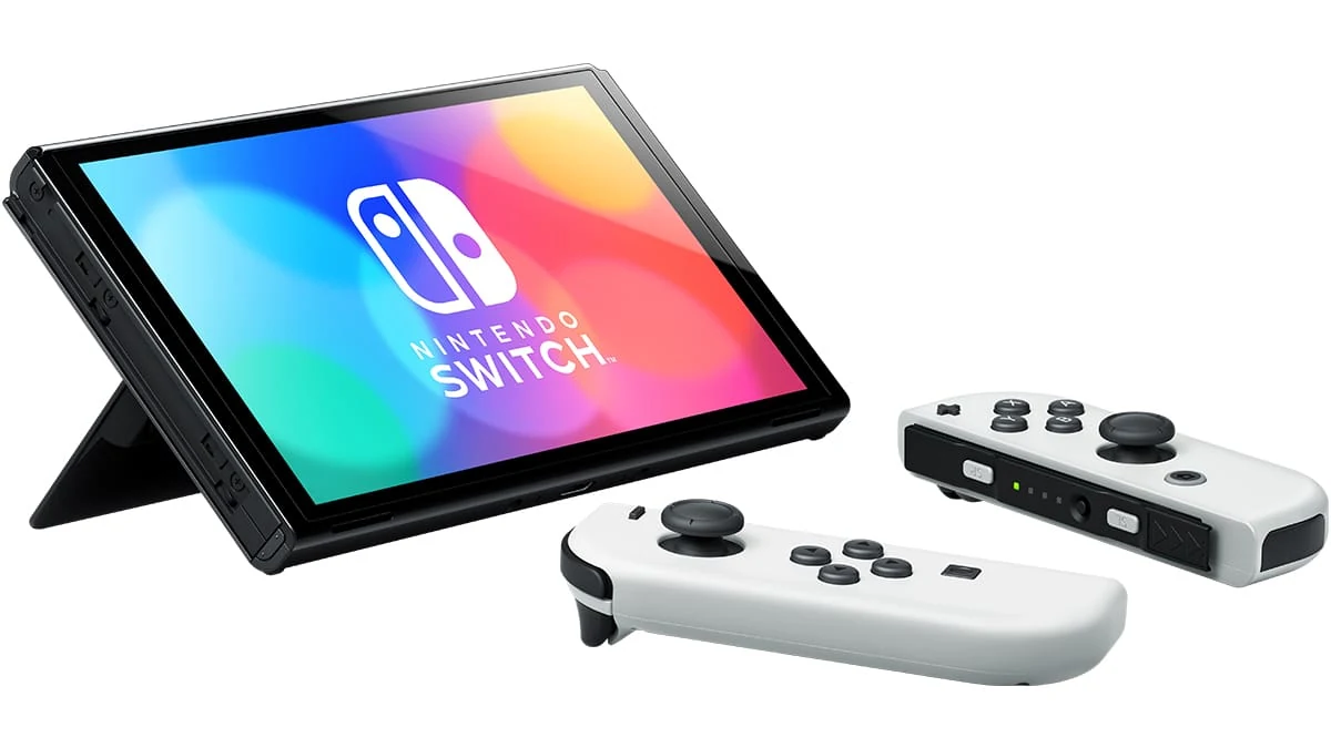 The Nintendo Switch OLED Model with White Joy-Con Controllers is shown in a top-down view, highlighting the device and controllers against a white background.