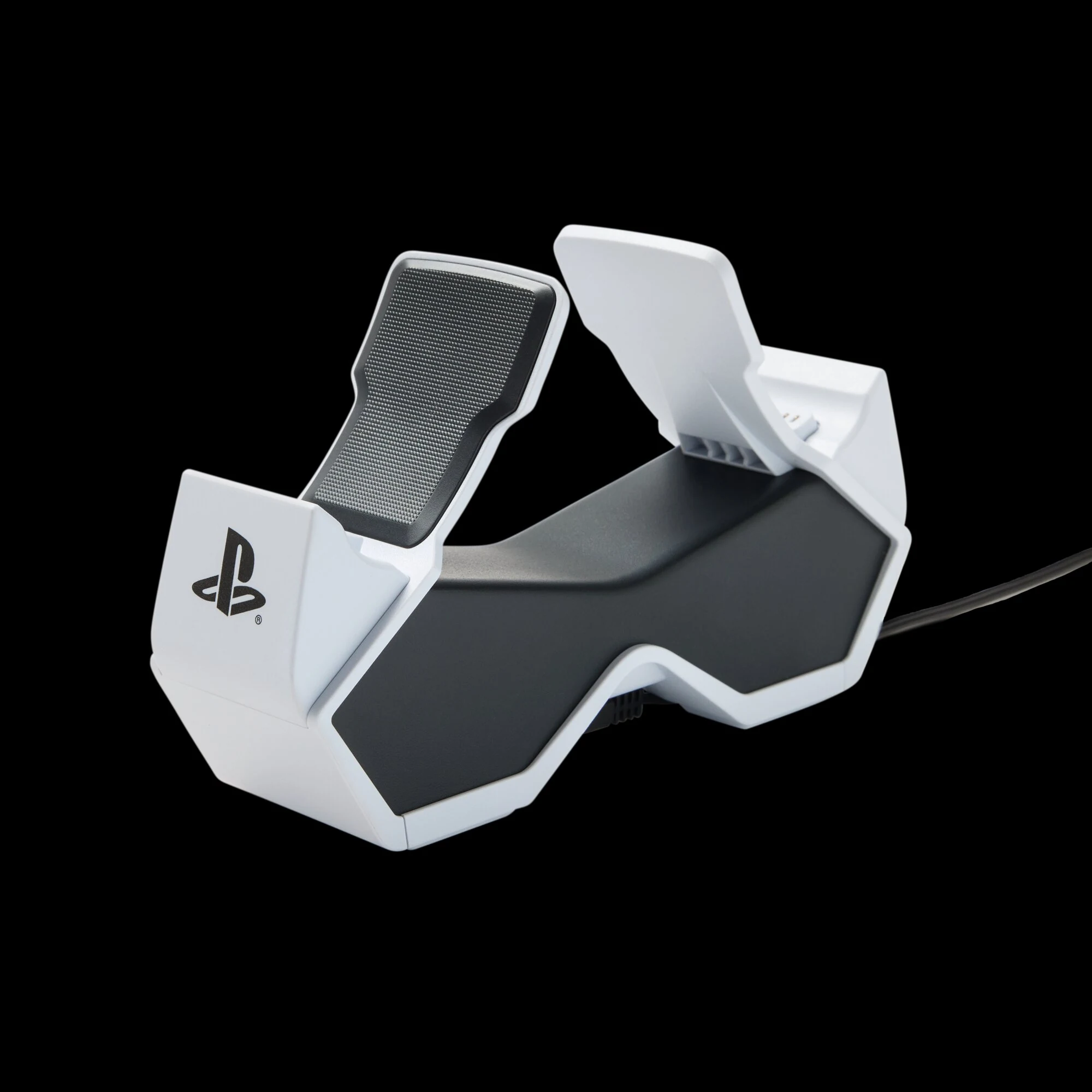 A white and black PlayStation-branded charging station with a textured surface, viewed from the side.