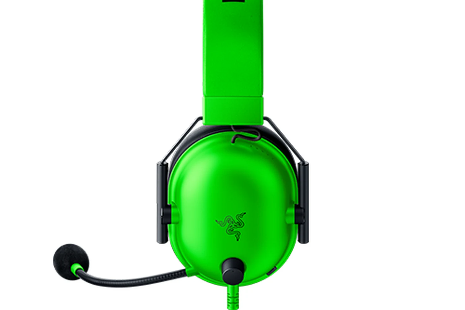 A close-up of a green Razer BlackShark V2 X headset with a microphone and earcup visible.