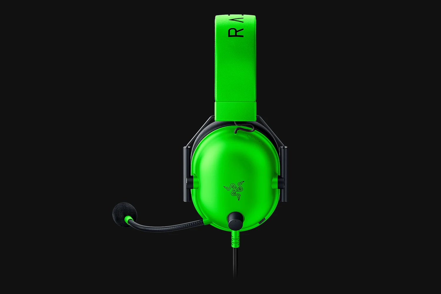 A bright green Razer BlackShark V2 X headset is shown from a top-down perspective, highlighting the ear cups and microphone.