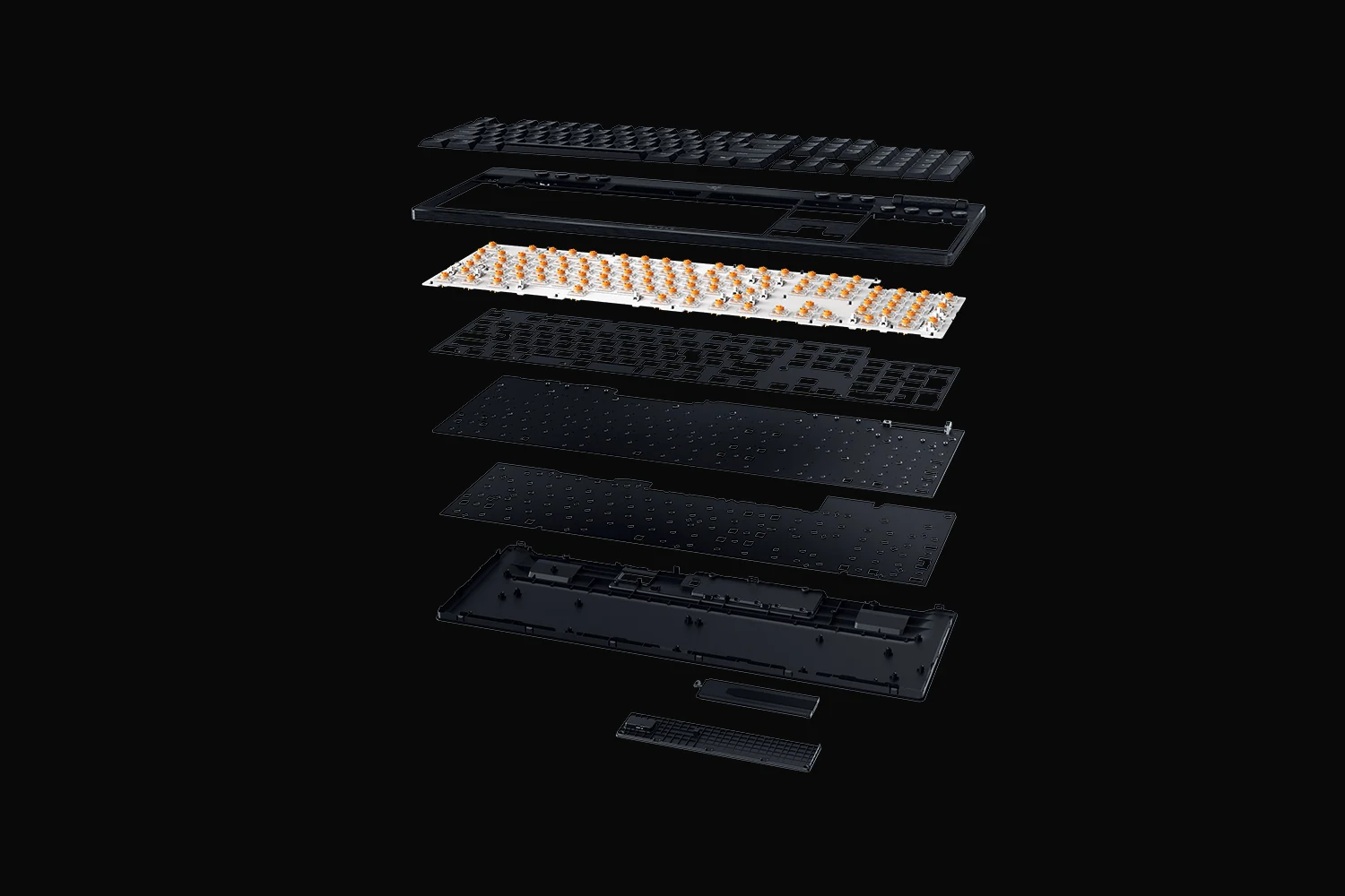 The image shows a disassembled keyboard with various components laid out against a black background.