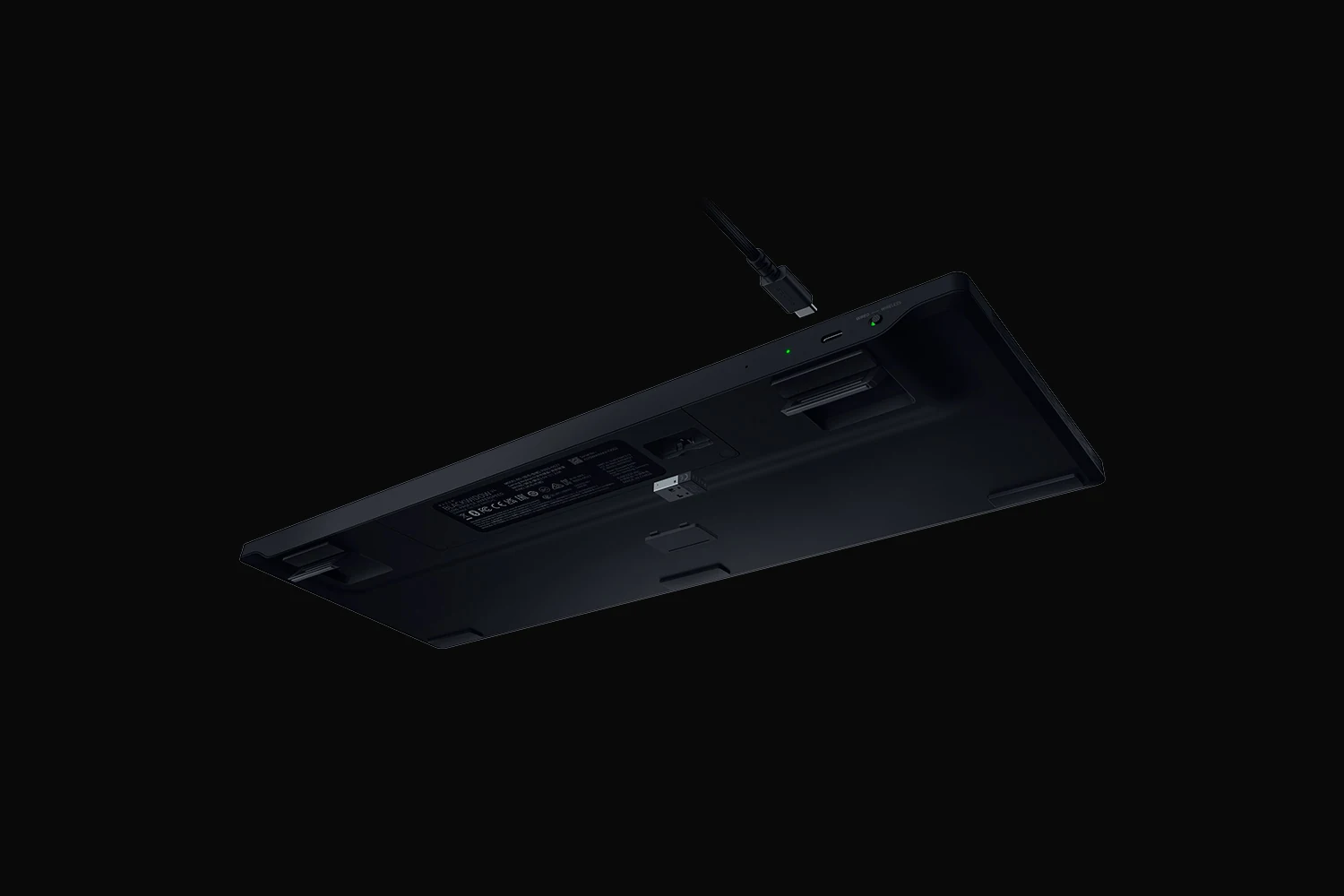 The Razer BlackWidow V4 Low-Profile HyperSpeed keyboard is photographed from a rear angle, showcasing its back panel and USB-C cable.