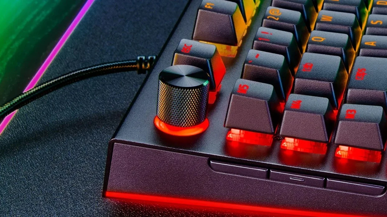 Close-up of the Razer Command Dial and the left-side macro keys on the BlackWidow V4 Pro, lit in red.