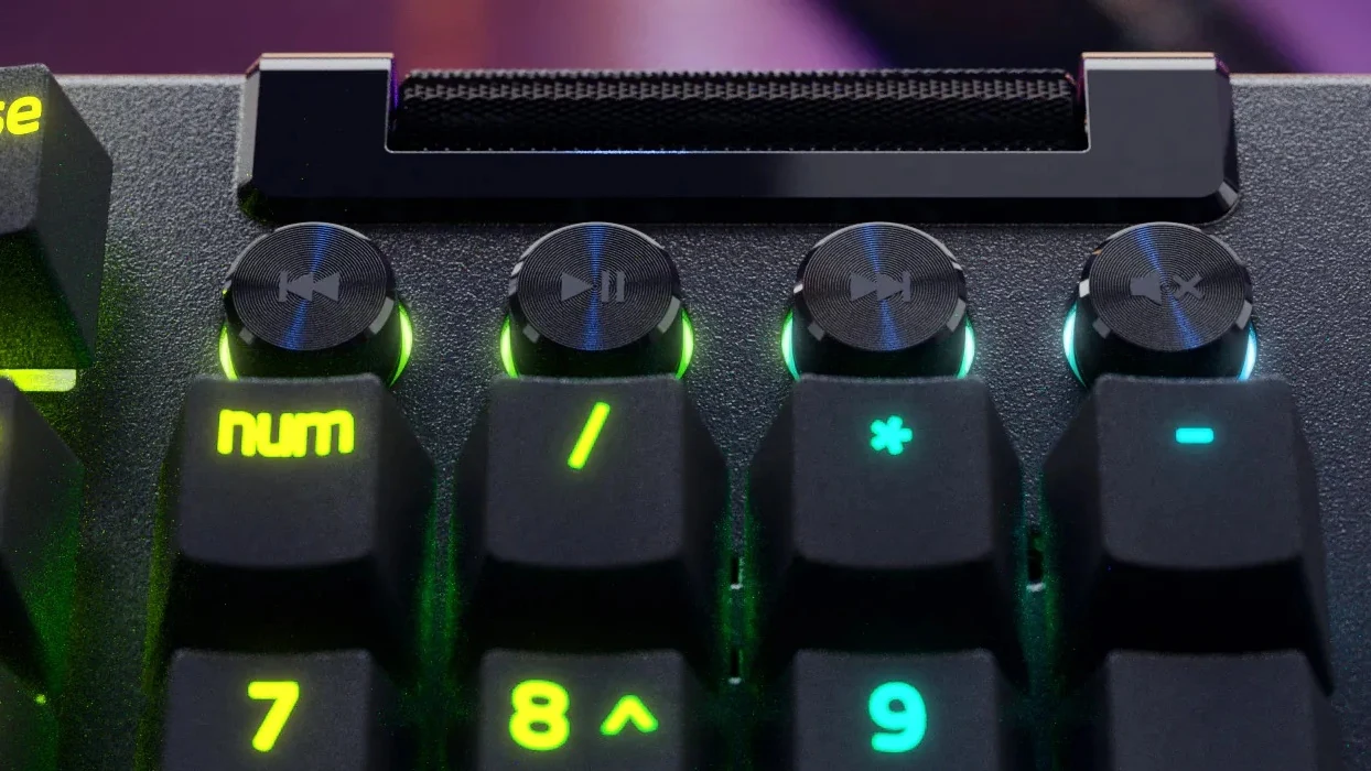Close-up of the multi-function roller and four media keys above the number pad of the BlackWidow V4 Pro.