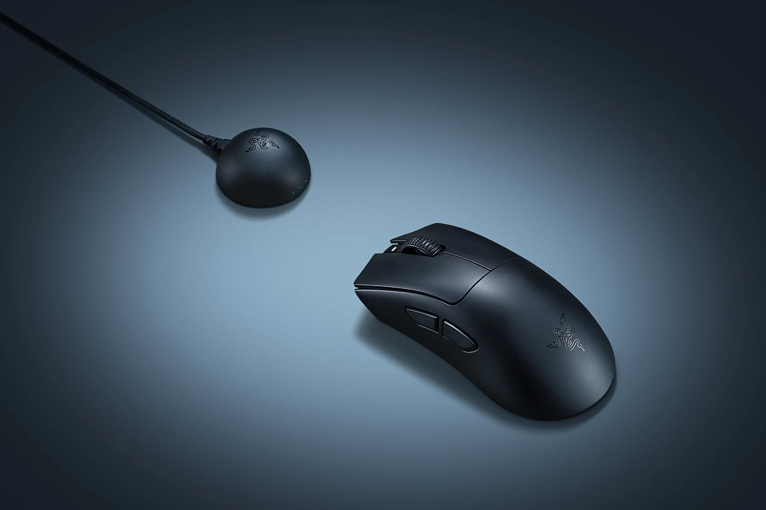 A black Razer DeathAdder V4 Pro mouse and its accompanying wireless receiver are shown in a side profile on a gradient background.