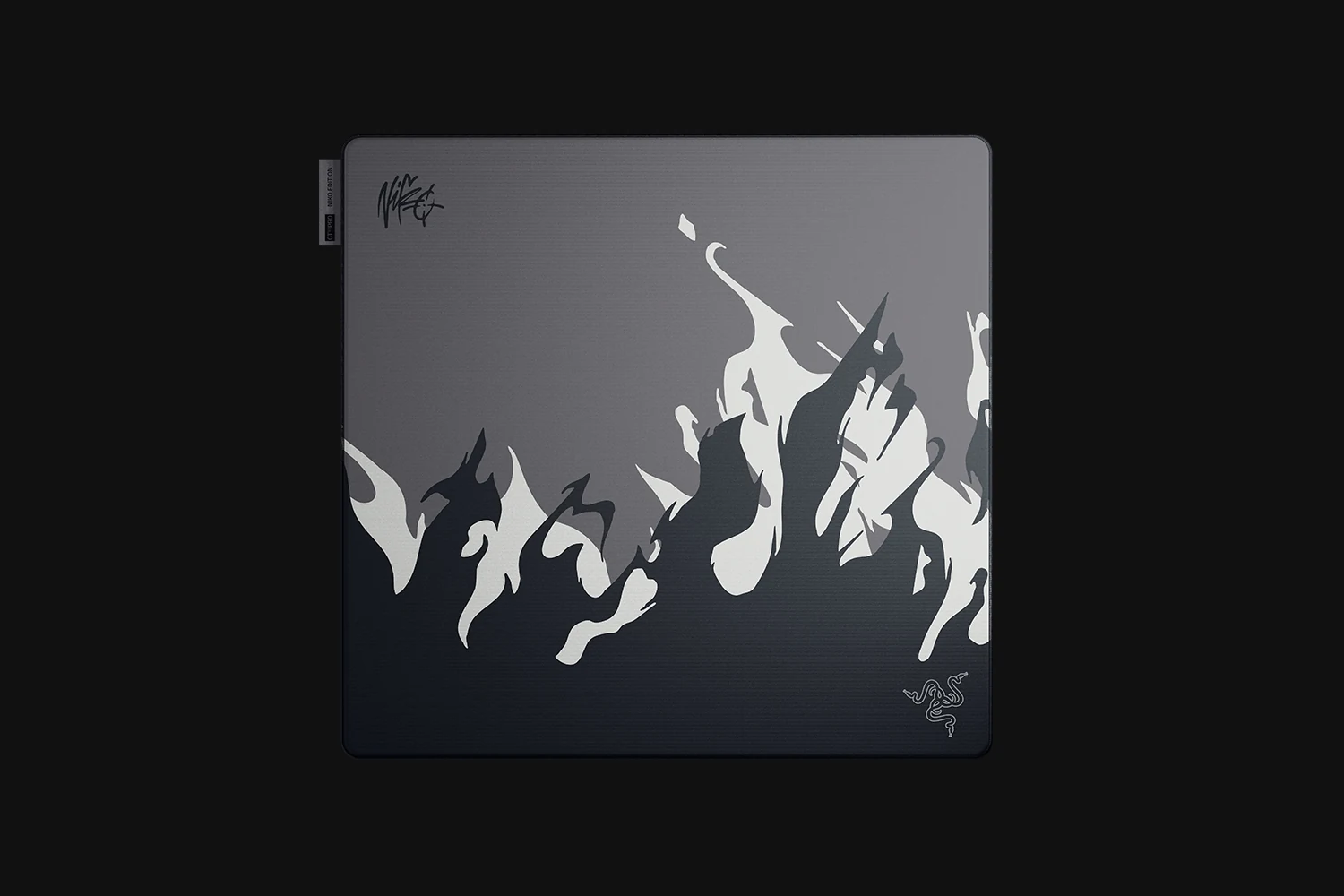 A top-down view of a Razer Gigantus V2 Pro Large NiKo Edition mousepad with a flame design on a dark background.