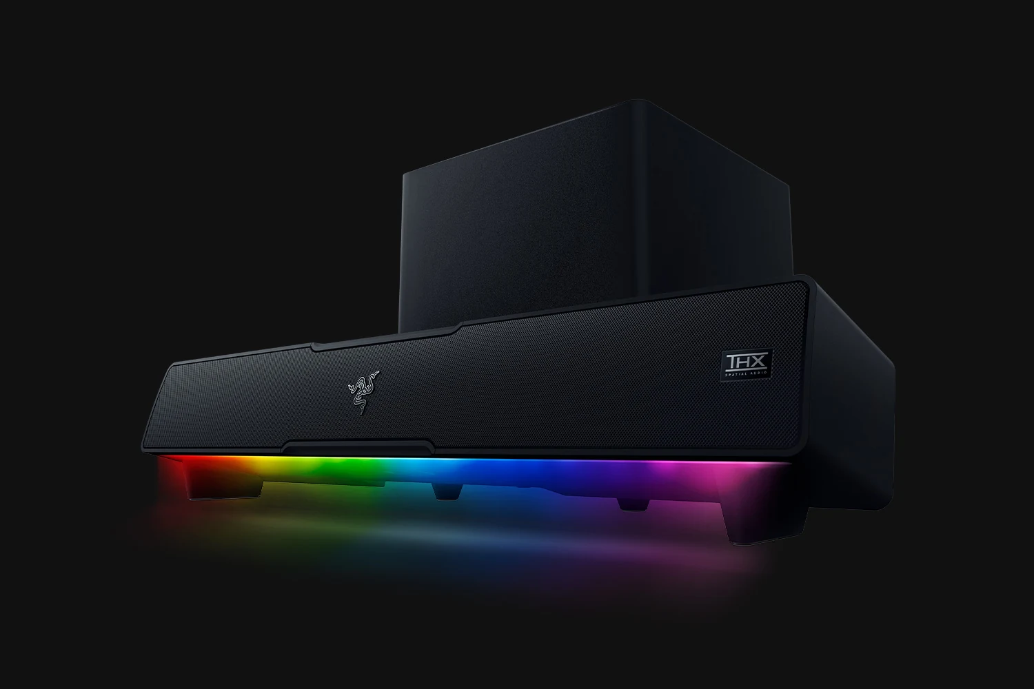 A black Razer Leviathan V2 speaker system with a top-down view, featuring a textured front and a rainbow LED light strip at the bottom.
