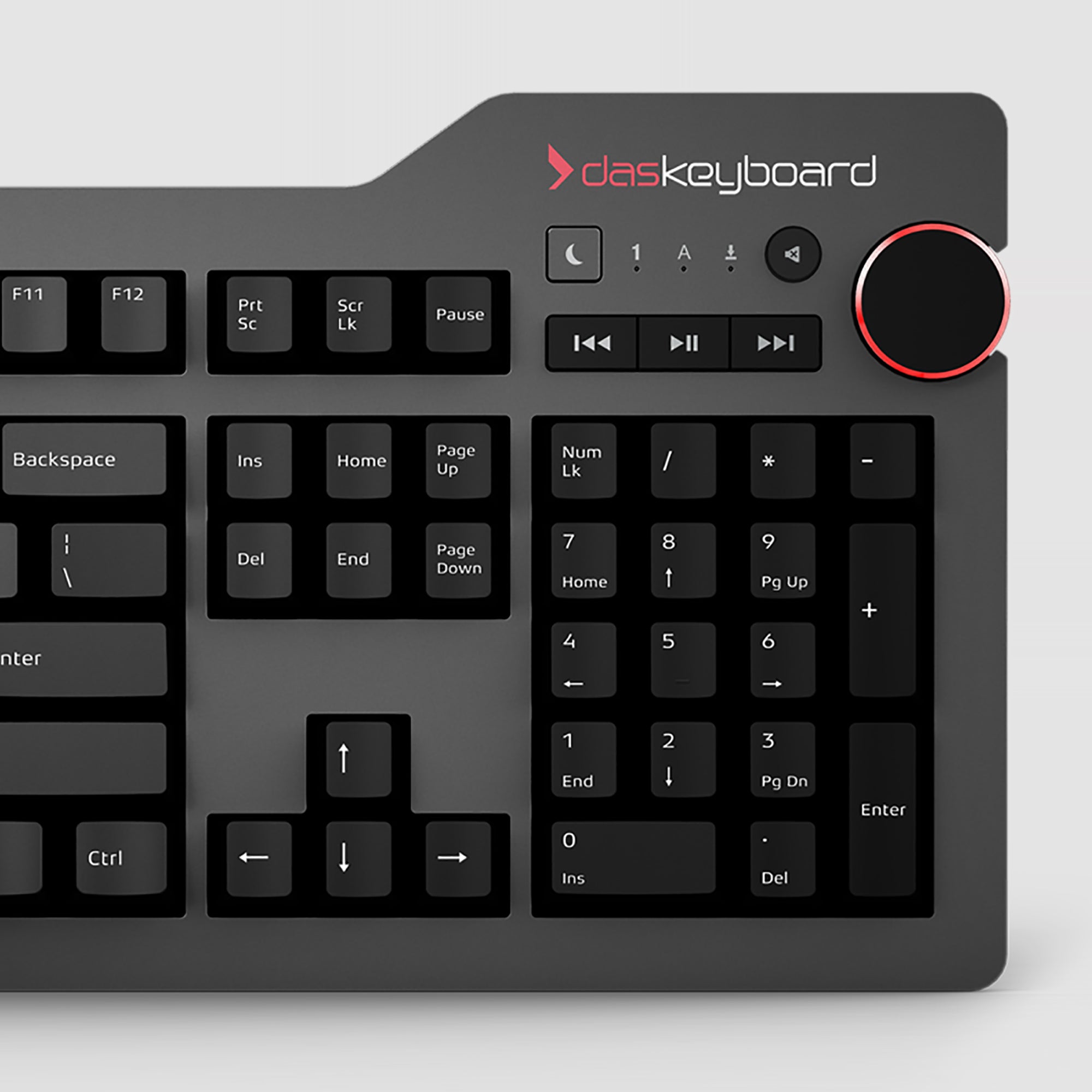 A close-up of a Das Keyboard 4 Root Wired Mechanical Keyboard with a dark finish and red accents on the keys.