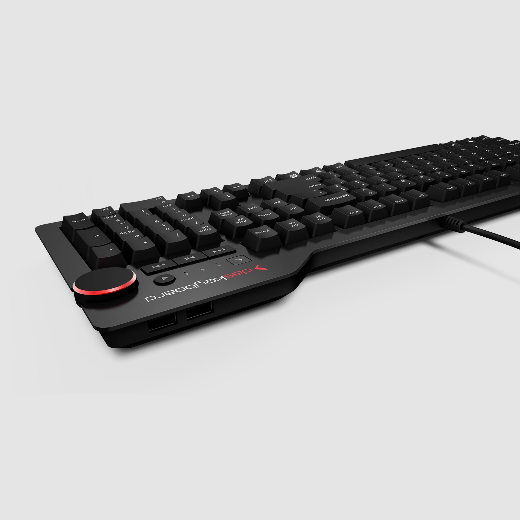 A black Das Keyboard 4 Root Wired Mechanical Keyboard with a side profile view, showing the USB ports and red accent on the left.