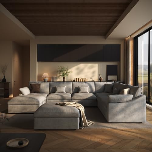 The image shows a Lazur Modular U-Shaped 8-Seat Cloud Couch in a light gray color, viewed from a three-quarter angle with the couch positioned against a wall and large windows behind it.