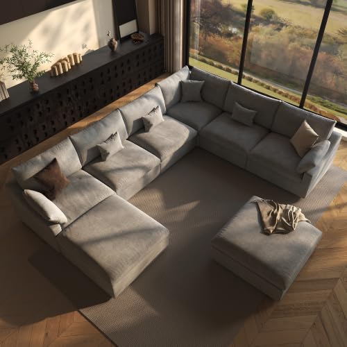 The image shows a Lazur Modular U-Shaped 8-Seat Cloud Couch in a side profile view, with the couch positioned against a large window and a wooden floor. The couch is upholstered in a light gray fabric.