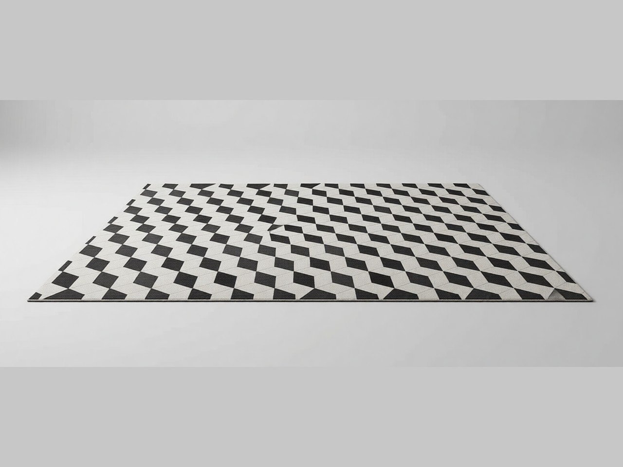 A cream and black diamond checkerboard area rug, shown on a plain grey background.