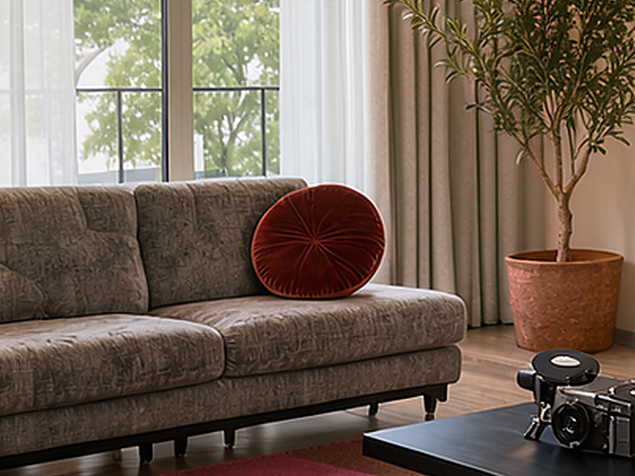 Close-up of the round yellow velvet cushion with radial pleats.