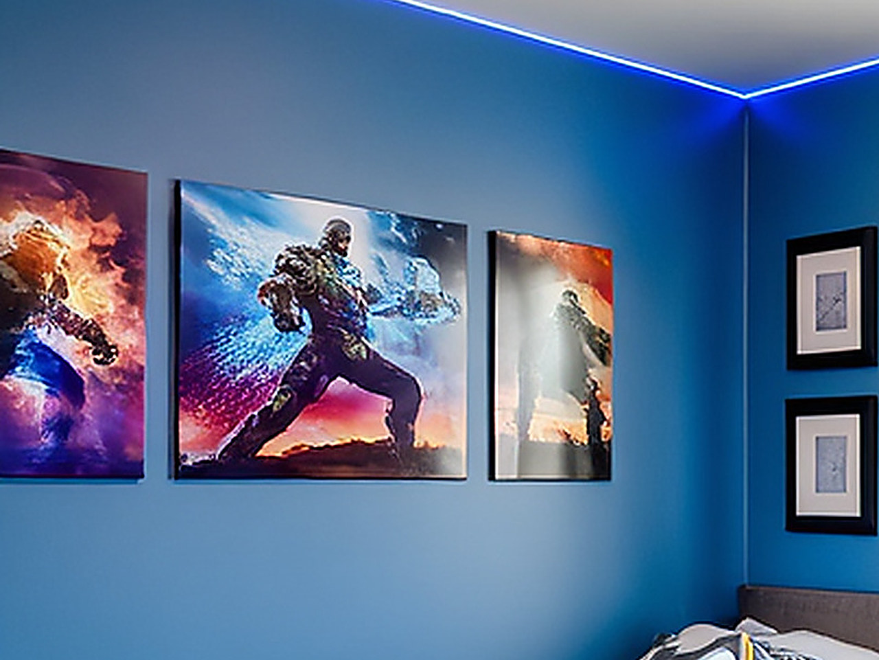 Close-up of the three framed canvas prints showing dynamic color bursts and smoke effects.