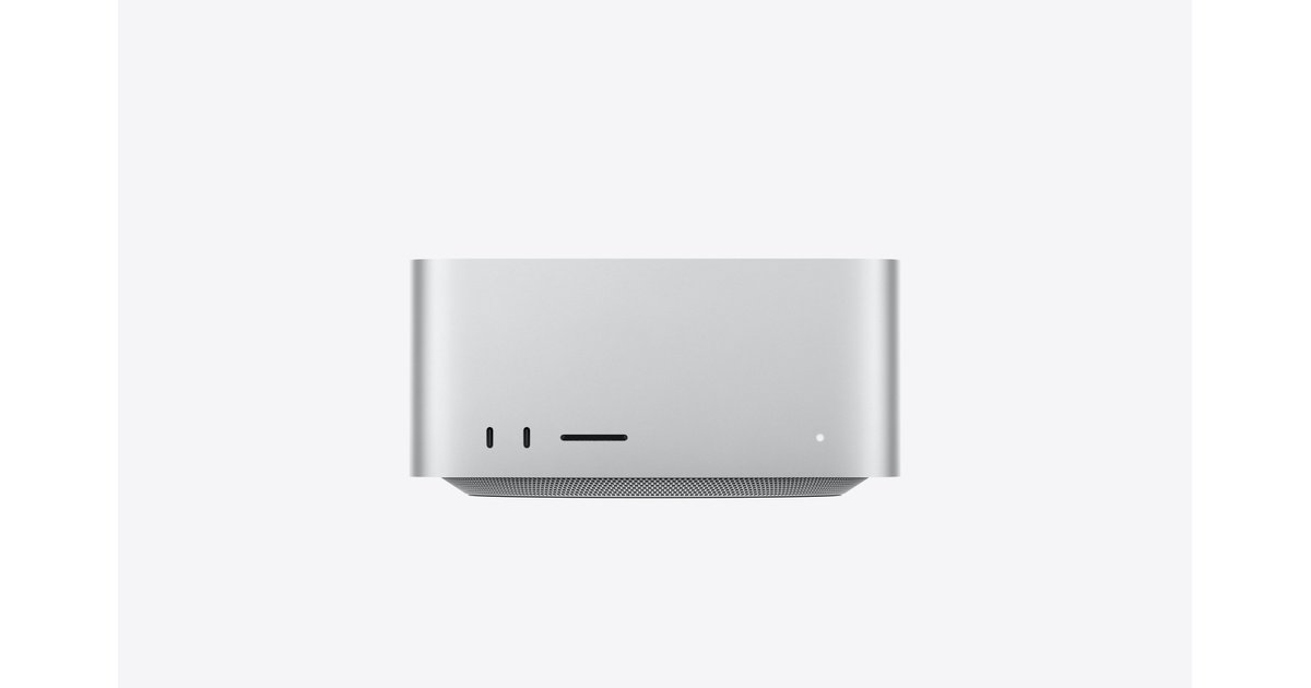 A silver Mac Studio desktop computer seen from the front on a light grey background.