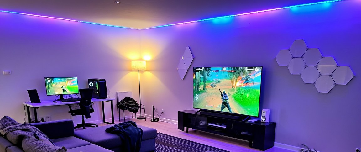 Close-up of the purple and cyan LED strips along the ceiling cove