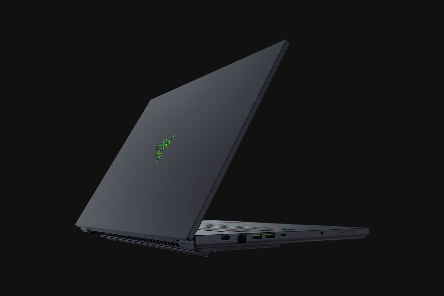 A black Razer Blade 18 gaming laptop photographed from a three-quarter angle, showcasing its back panel and rear ports.