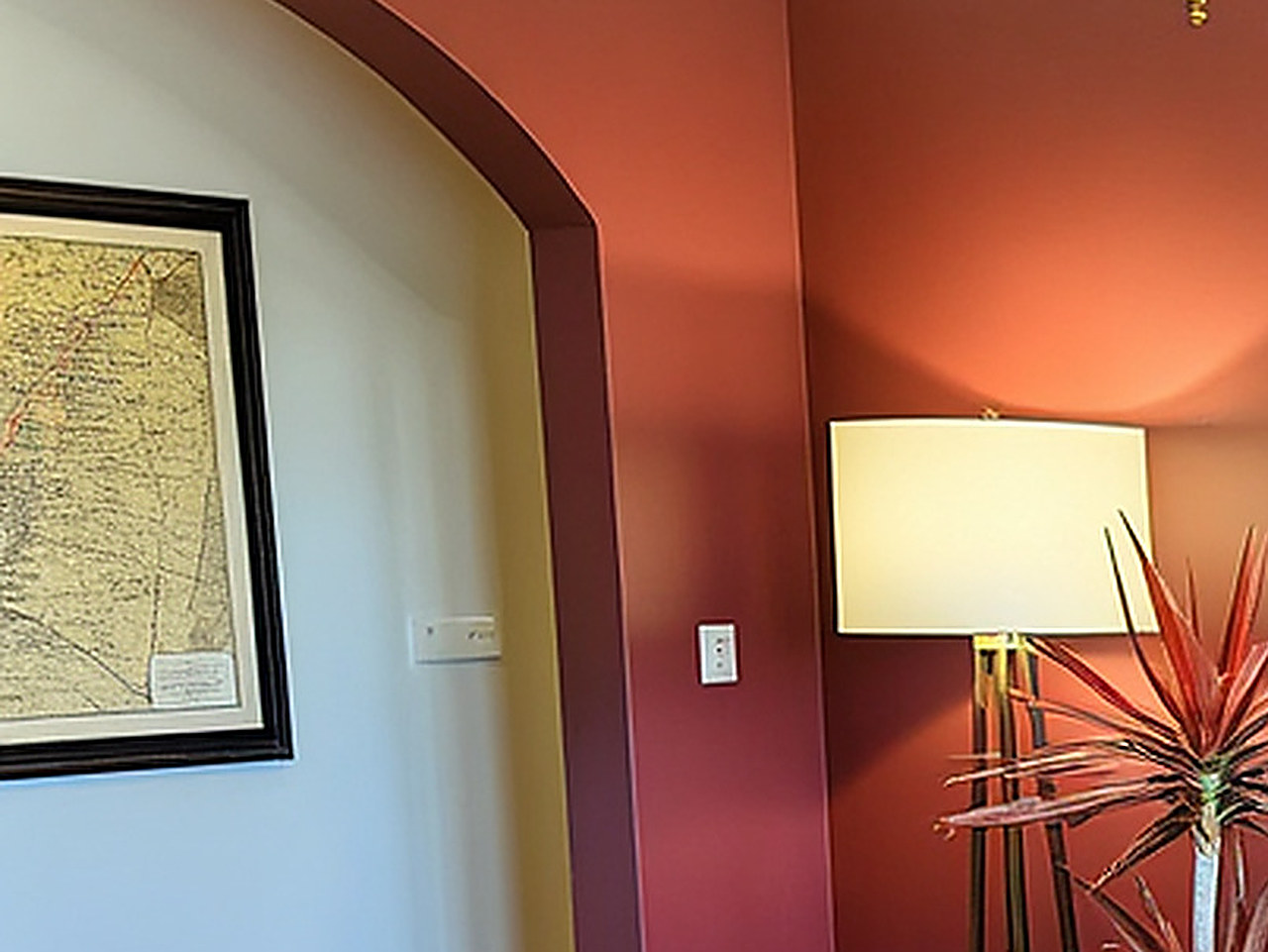 Close-up of the gold frame edge and painted white hydrangea details.