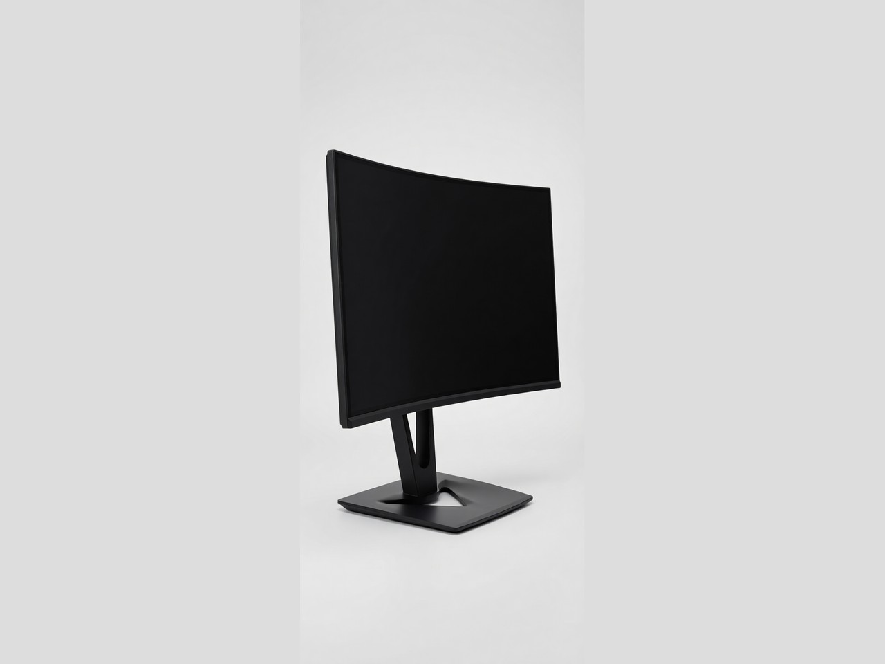 A black curved monitor with a sleek stand is shown on a plain grey background.