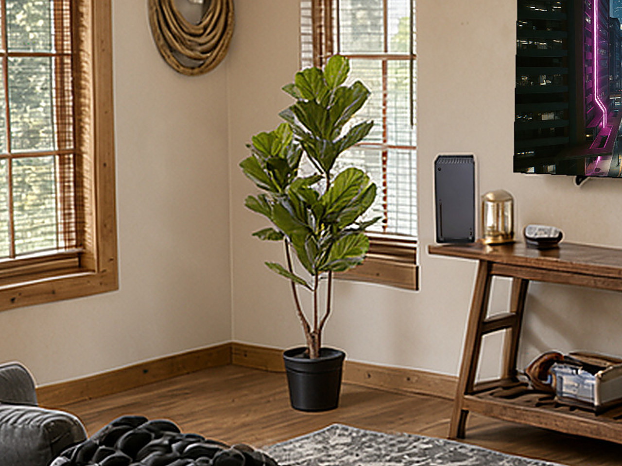 A close-up of the artificial fiddle leaf fig plant in its black pot.